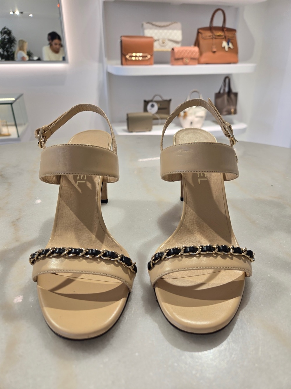 CHANEL Beige Slingback Heels with Black-and-Gold Chain